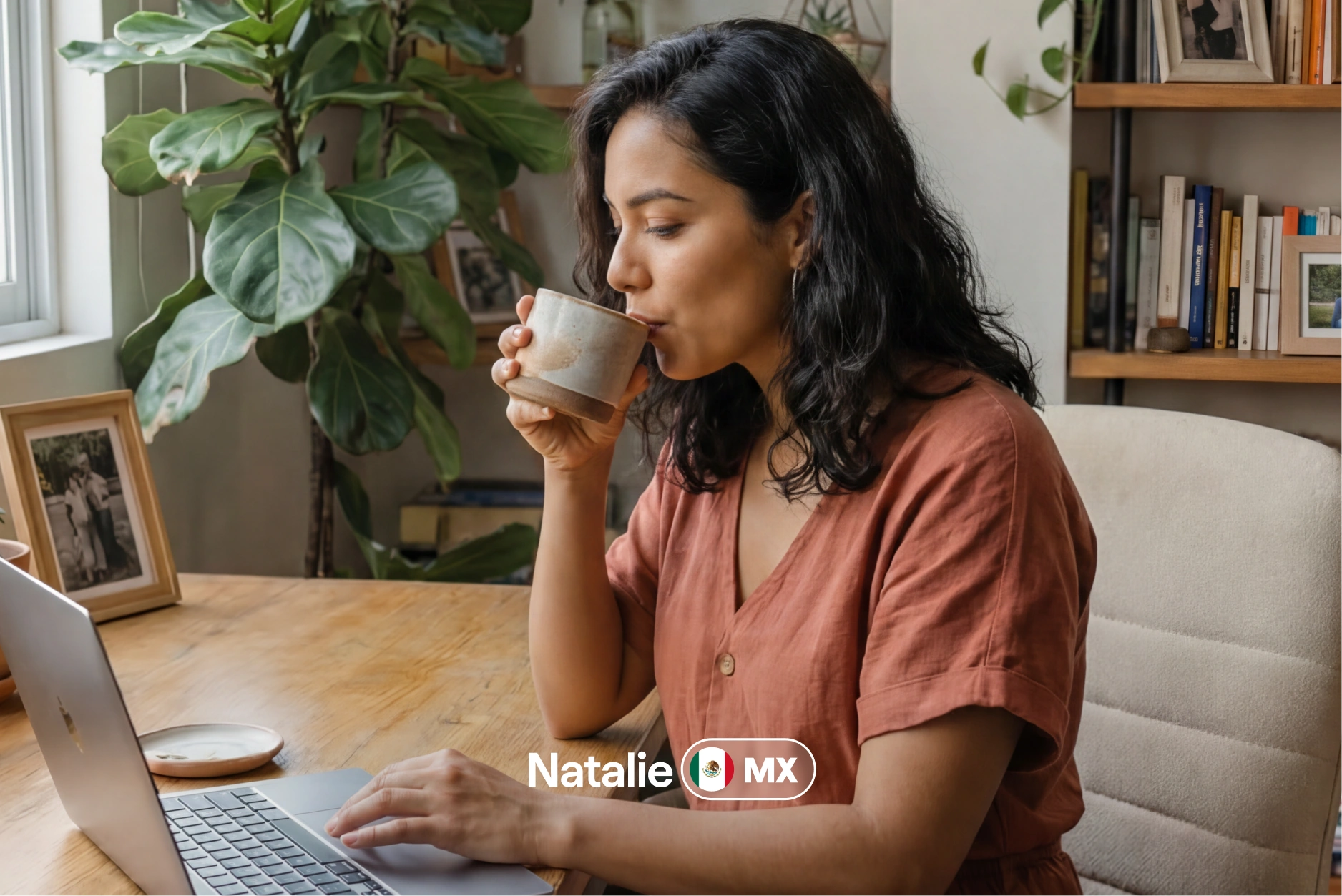 Natalie from Mexico at her laptop with a coffee in hand