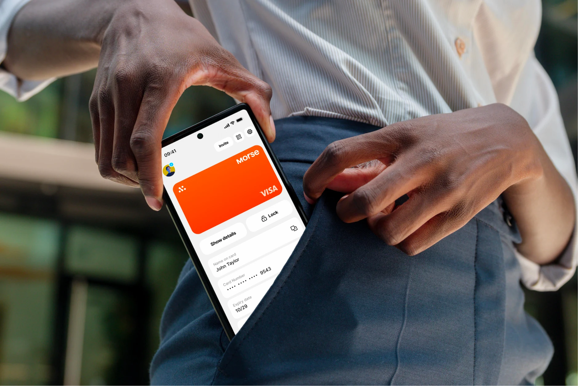 Morse Card on a phone being slipped into a pocket